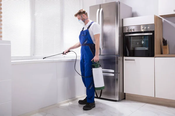 depositphotos_182951634-stock-photo-young-male-exterminator-worker-spraying (2)